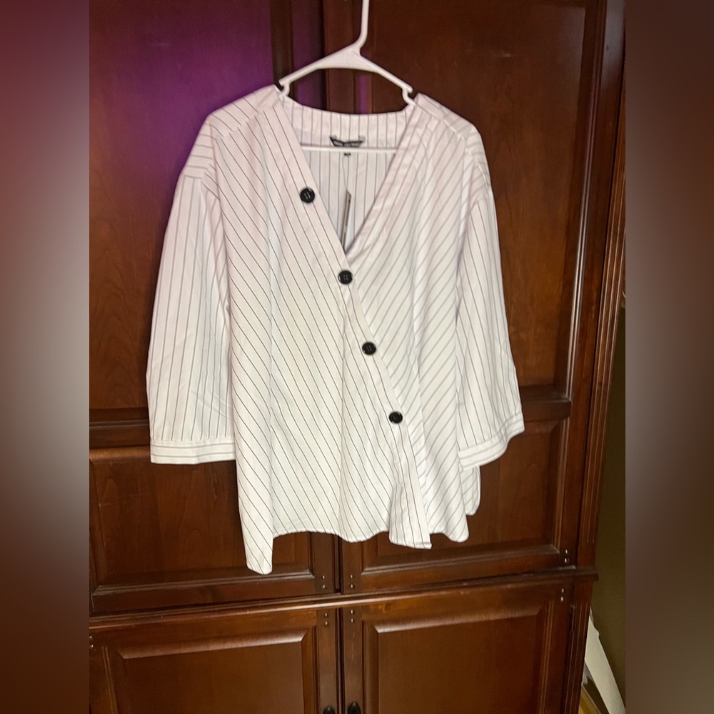Fun pin striped chef styled loose fitting top.